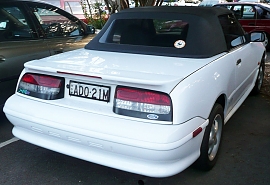 1200px-1993-1994_Ford_Capri_(SE)_XR2_convertible_01.jpg